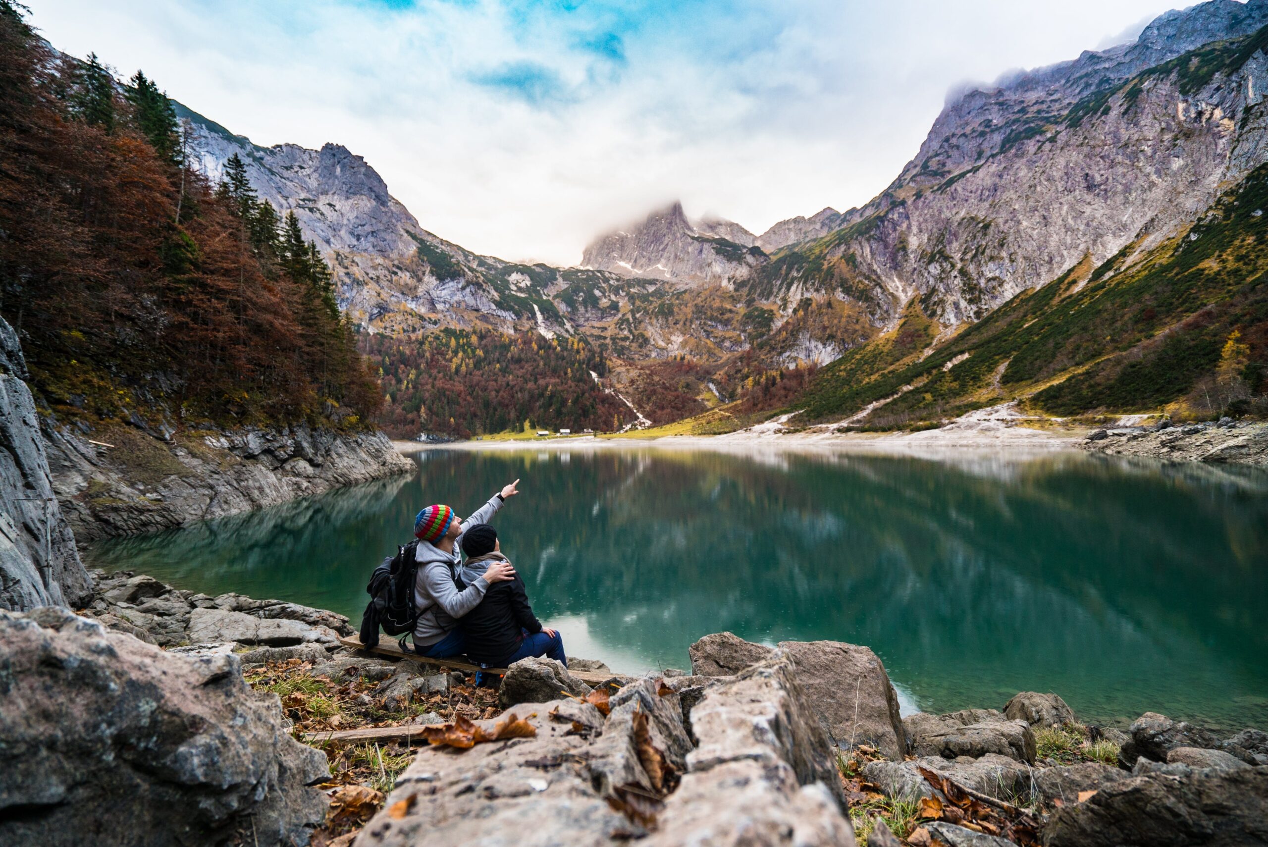 Adventure dating success as a couple are enjoying the scenic views of the mountains