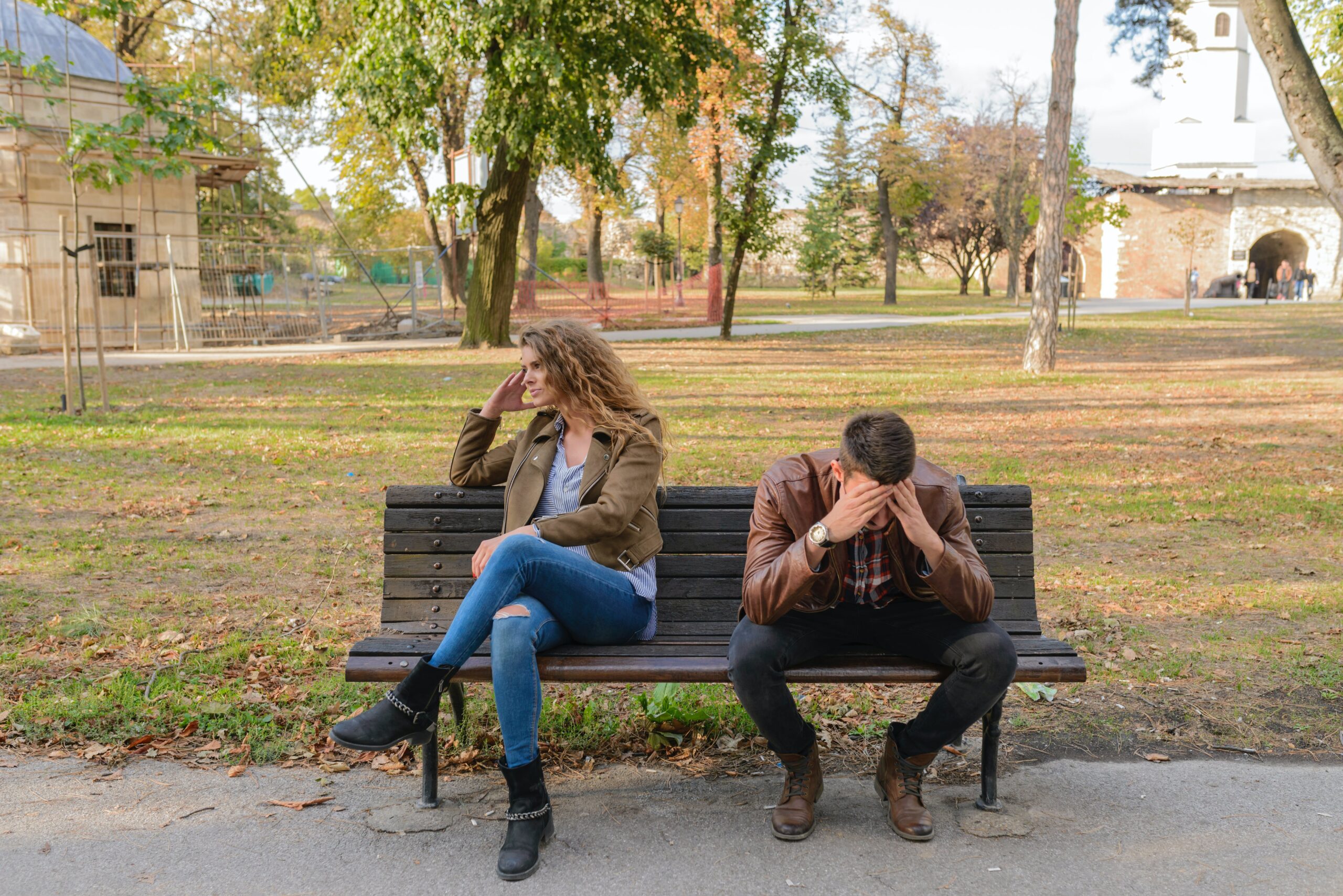 couple on a bench trying to work on saving their marriage