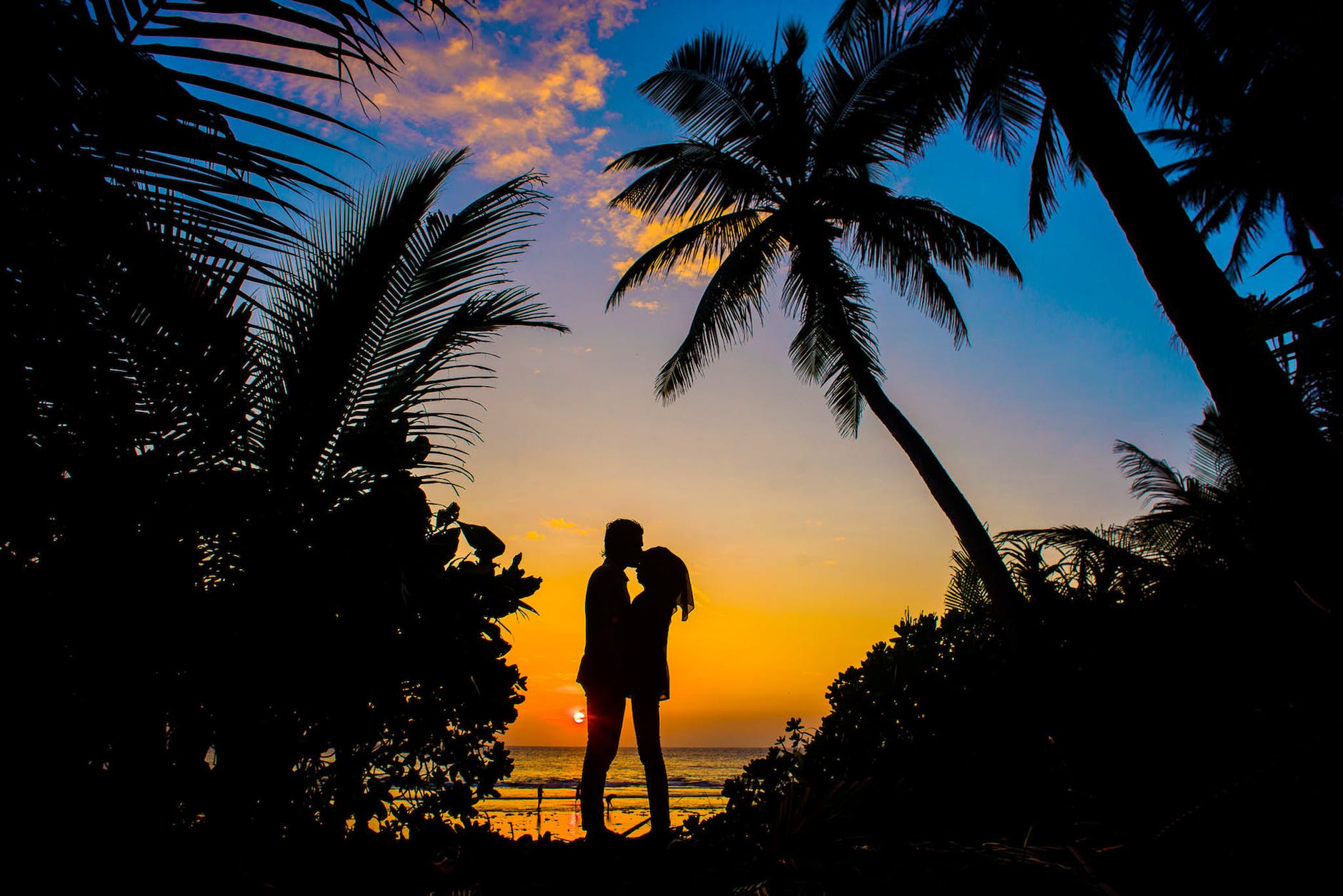 silhouette of man and woman kissing because they just reignited the flame in their relationship